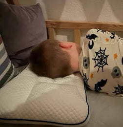Parent photo of a child asleep on the Hushly Kids pillow