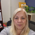 Reviewer photo: a woman with fair hair in a living room with houseplants