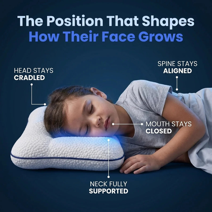 A child asleep on the Hushly Kids pillow: head cradled, neck supported, mouth closed, spine aligned