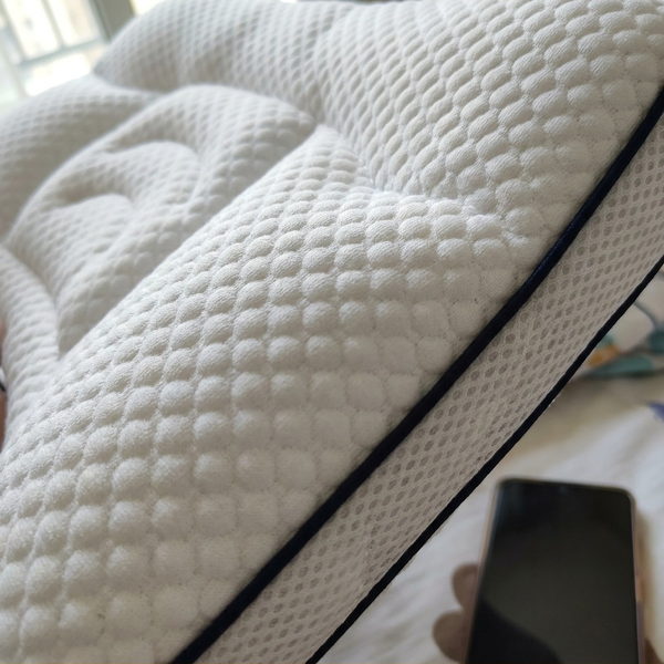 Close-up of the Hushly Kids pillow's cover and piping